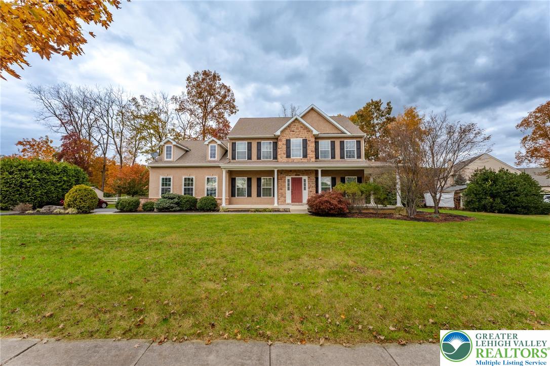 3505 Woodbyne Road Hellertown, PA 18055 - Photo 55 of 66 a front view of a house with a garden