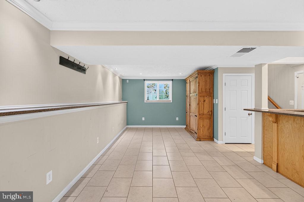 8471 Great Lake Lane Springfield, VA 22153 - Photo 31 of 65 a view of a big room with closet and windows
