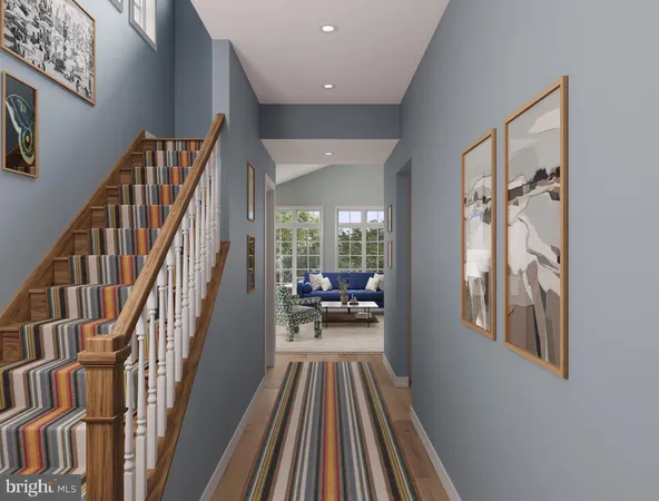 a view of entryway and hall with wooden floor