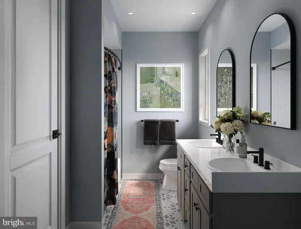 a en suite bathroom with a sink and a mirror