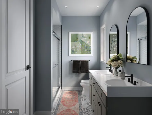 a en suite bathroom with a sink and a mirror