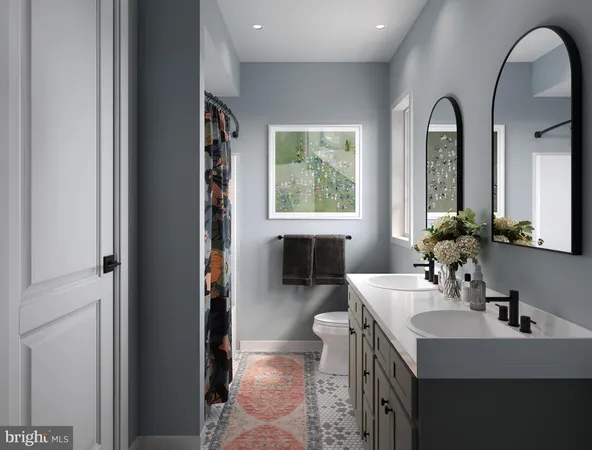 a en suite bathroom with a sink and a mirror