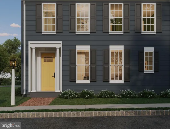 a front view of a brick house with a yard