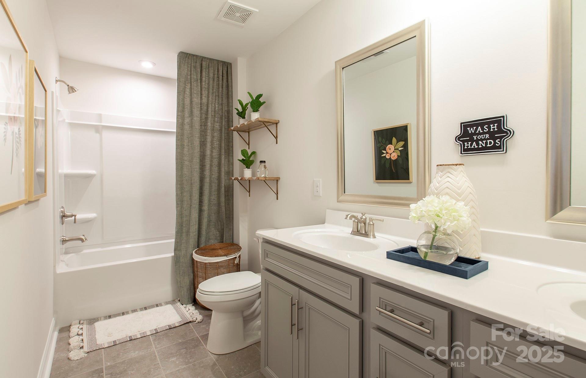 4715 Formation Court, Unit 47 Lancaster, SC 29720 - Photo 11 of 14 a bathroom with a sink a toilet and shower