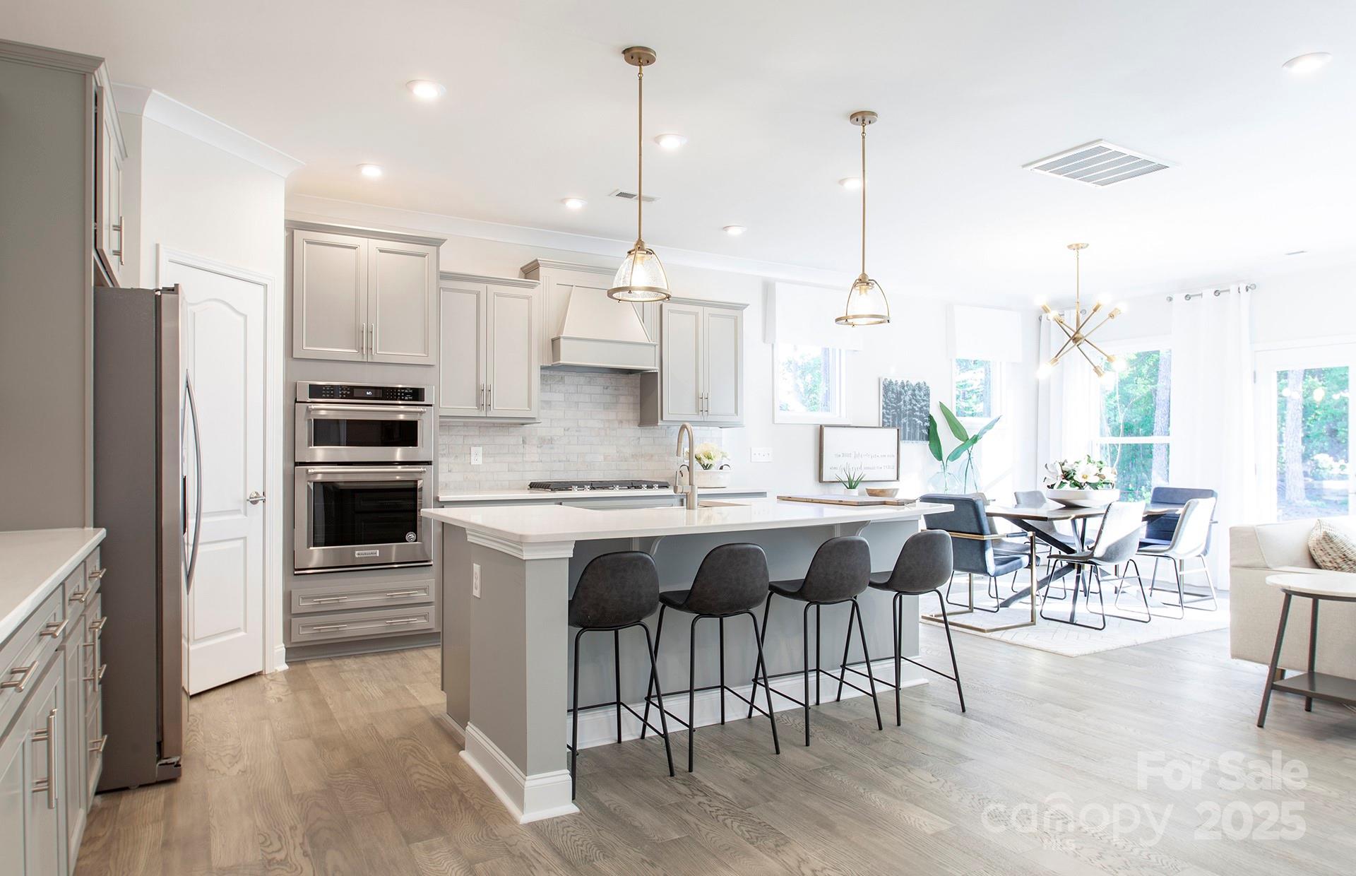 4715 Formation Court, Unit 47 Lancaster, SC 29720 - Photo 2 of 14 a large kitchen with kitchen island a large island in it