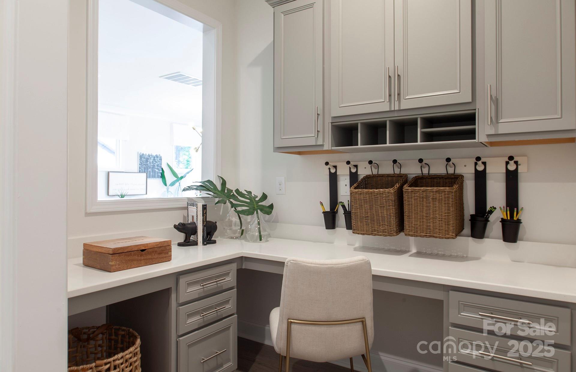 4715 Formation Court, Unit 47 Lancaster, SC 29720 - Photo 6 of 14 a kitchen with stainless steel appliances a sink a stove and white cabinets
