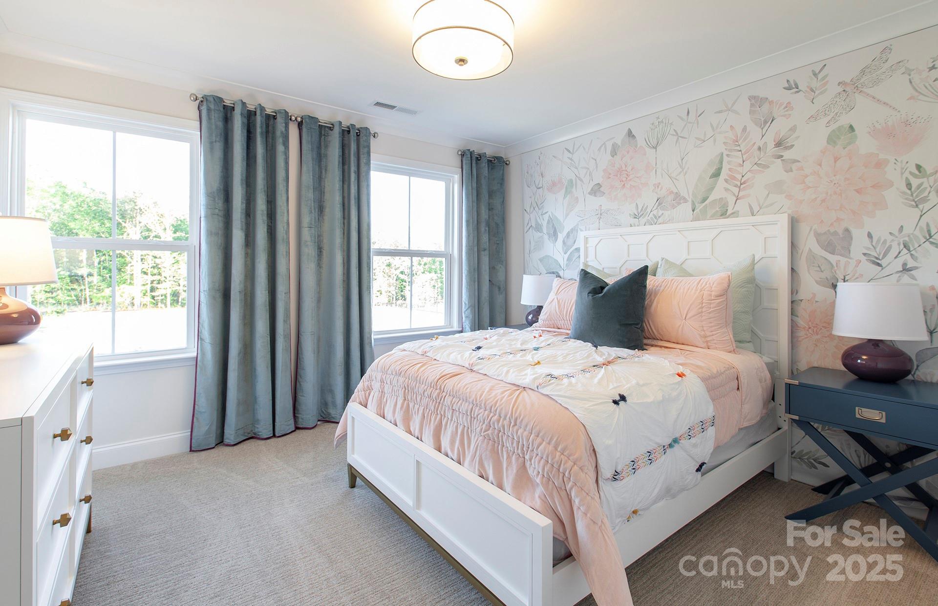 4715 Formation Court, Unit 47 Lancaster, SC 29720 - Photo 7 of 14 a large bed sitting in a bedroom next to a window