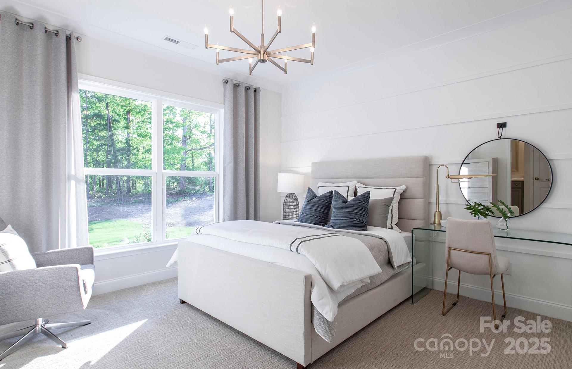 4715 Formation Court, Unit 47 Lancaster, SC 29720 - Photo 10 of 14 a large white bed sitting in a bedroom next to a window