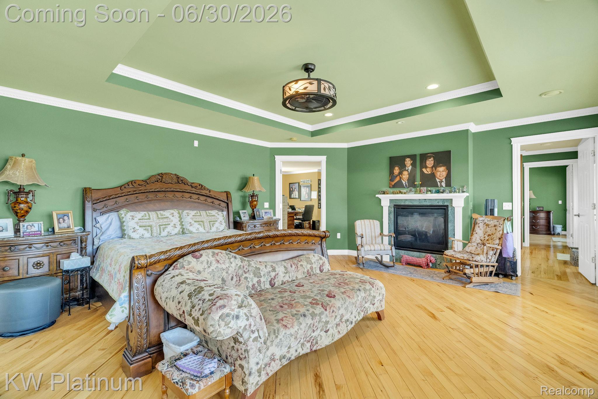 2235 South Lake Shore Road Harbor Beach, MI 48441 - Photo 32 of 99 Spacious room featuring light wood-finish flooring, a tray ceiling, and a fireplace with a stone surround and white mantel