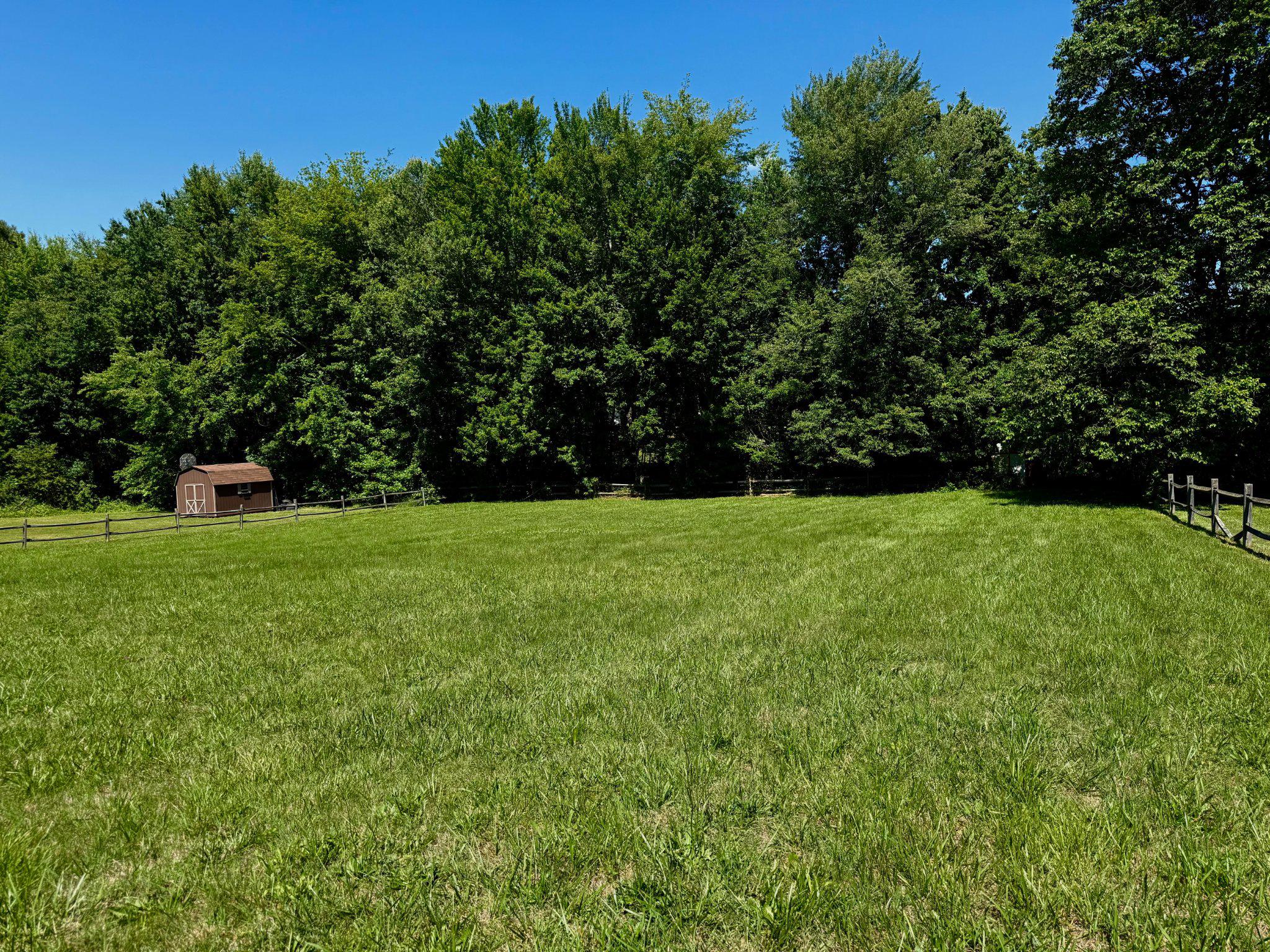 1900 Poplar Road Stafford, VA 22556 - Photo 4 of 4 Flat backyard surrounded by a split rail fence