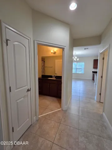a view of a hallway and a livingroom with a furniture