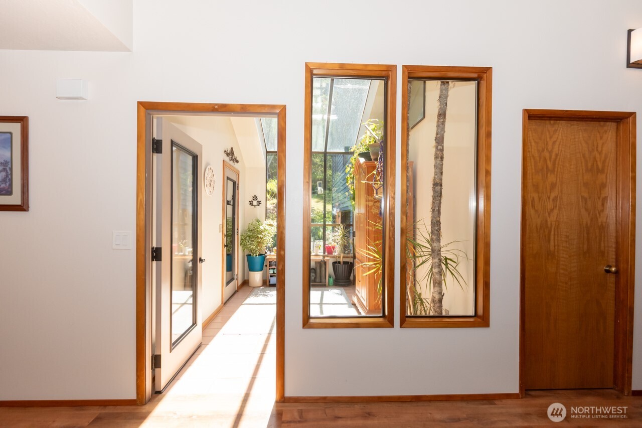 492 Walkabout Way Port Angeles, WA 98363 - Photo 25 of 40 a view of a front door and bedroom from a hallway