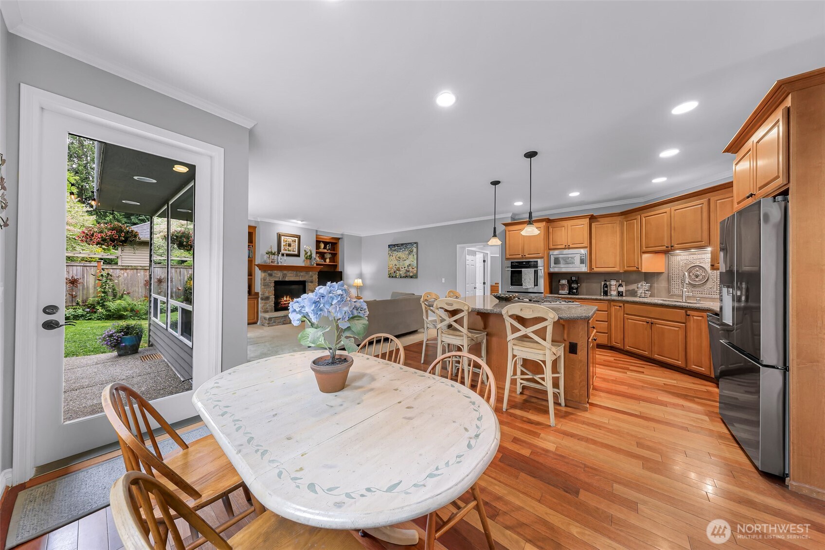 2029 240th Place Southeast Bothell, WA 98021 - Photo 14 of 39 a view of a dining room with furniture and wooden floor