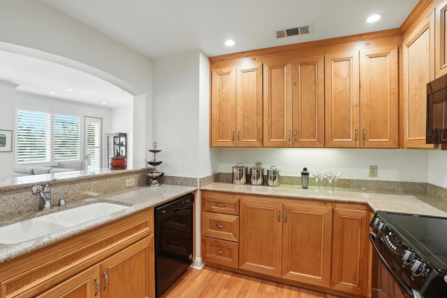 10 Crystal Springs Road, Unit 1507 San Mateo, CA 94402 - Photo 12 of 33 a kitchen with a sink stove and cabinets