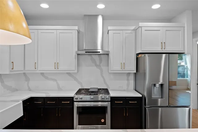 a kitchen with a stove and a refrigerator