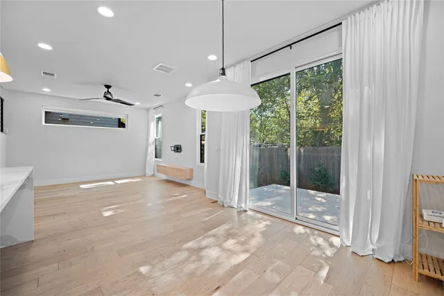 a bathroom with a shower and a toilet