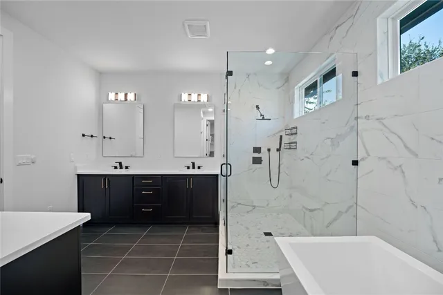 a bathroom with a bathtub and a sink