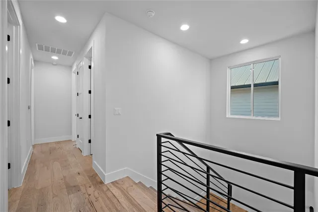 a bathroom with a double vanity sink mirror and toilet
