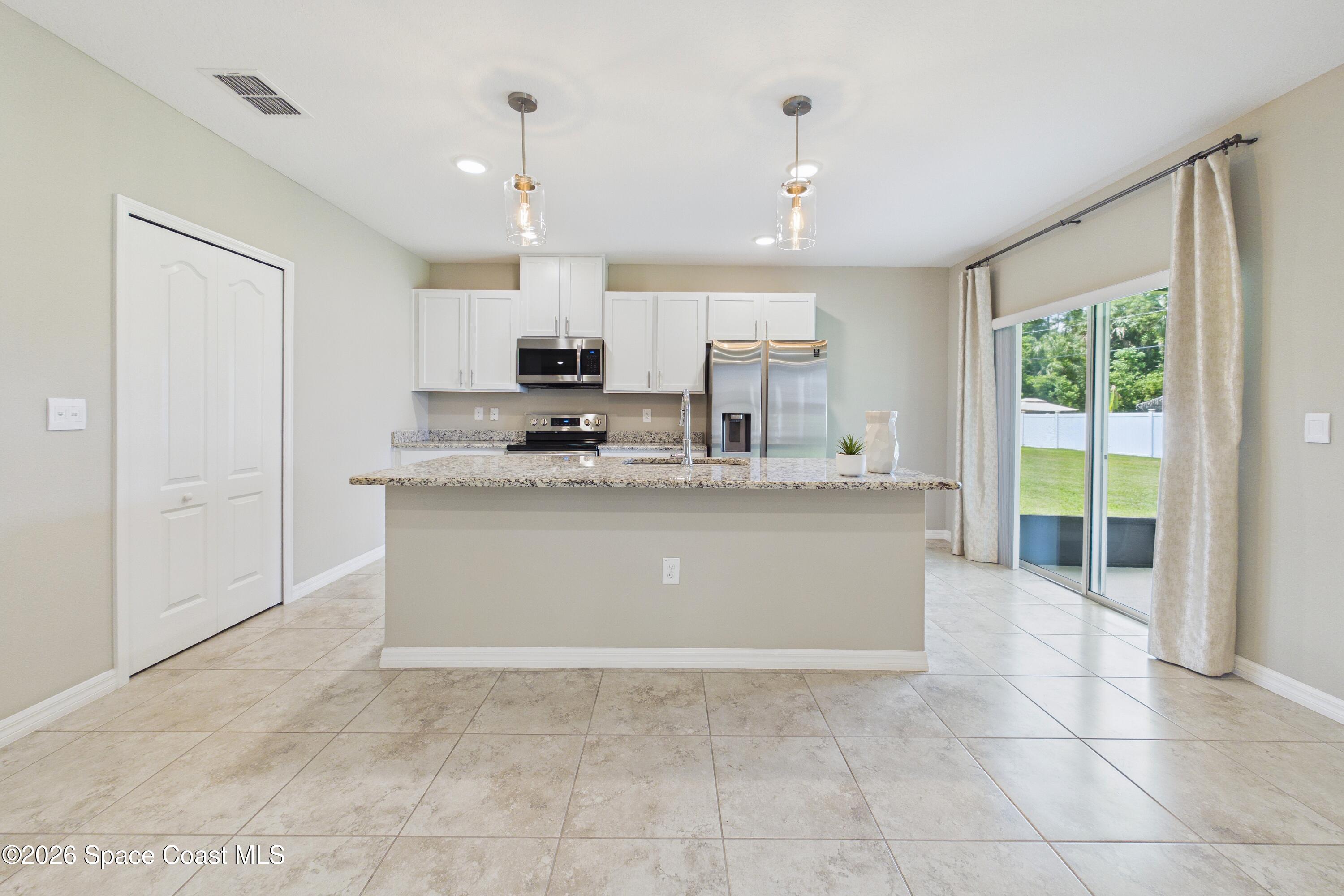 1610 Degroodt Road Southwest Palm Bay, FL 32908 - Photo 12 of 69 kitchen vase
