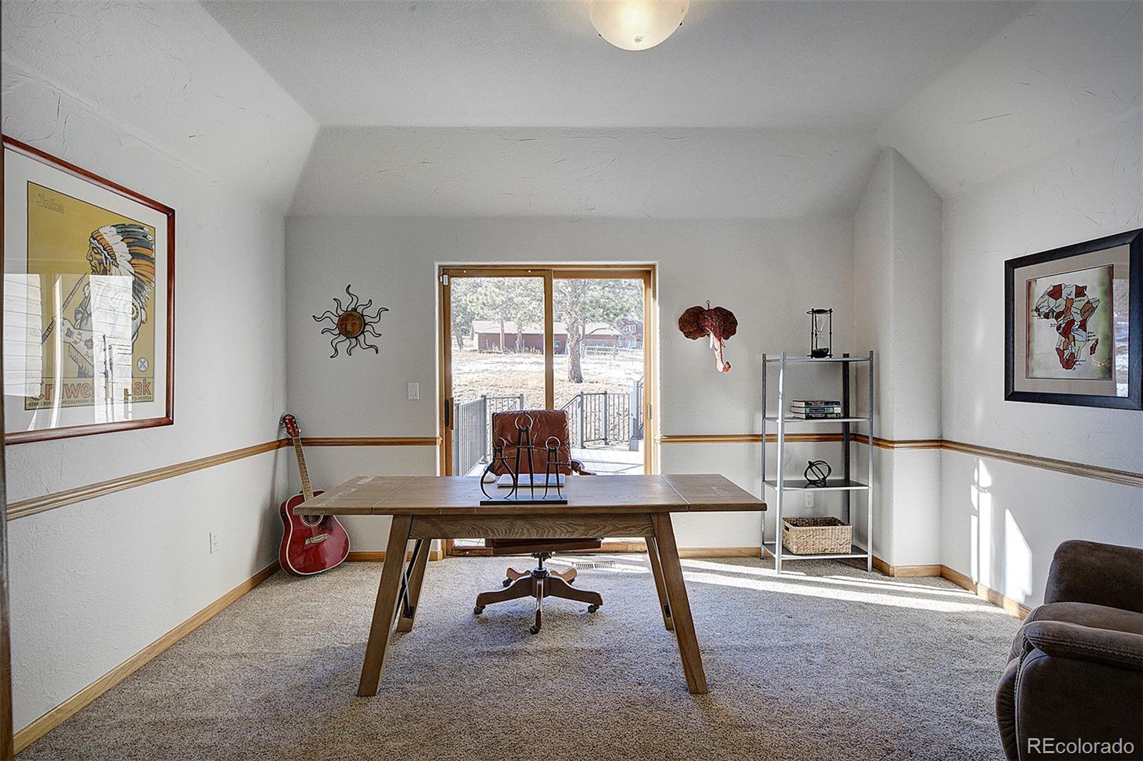 5371 Hazel Road Evergreen, CO 80439 - Photo 24 of 47 a room with furniture and window