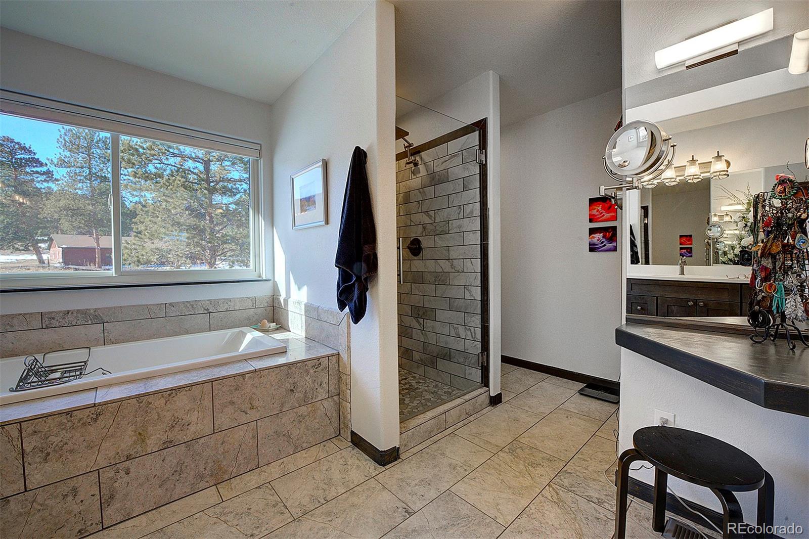 5371 Hazel Road Evergreen, CO 80439 - Photo 32 of 47 a kitchen with refrigerator and window