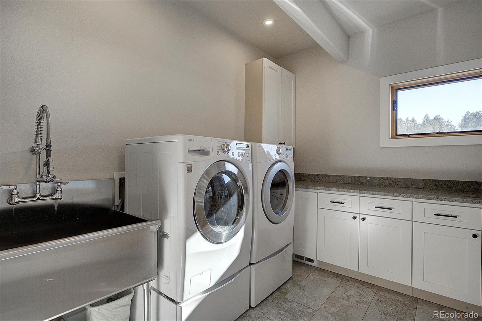 5371 Hazel Road Evergreen, CO 80439 - Photo 44 of 47 a utility room with dryer and washer
