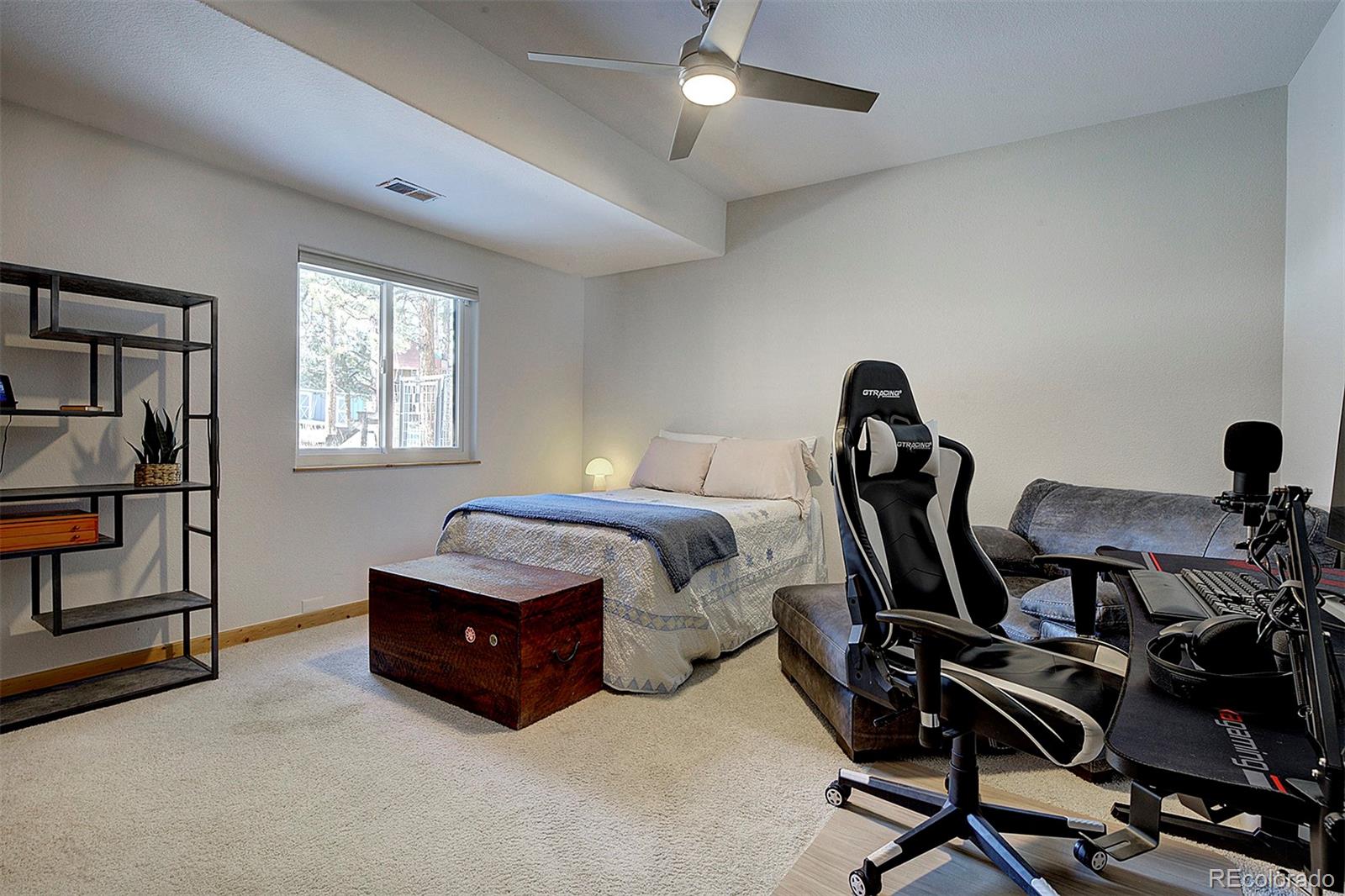 5371 Hazel Road Evergreen, CO 80439 - Photo 46 of 47 a bedroom with bed and a window