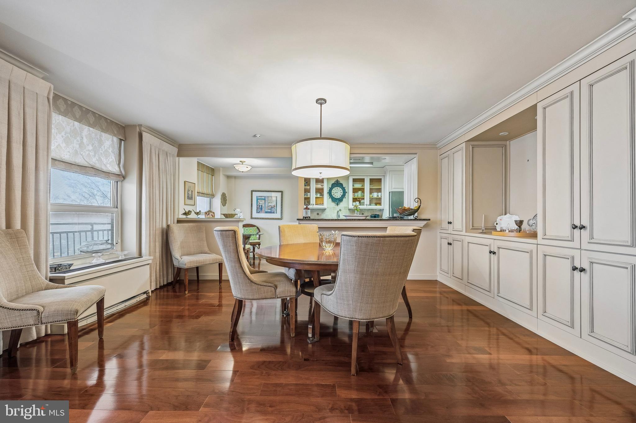 41 Conshohocken State Road, Unit 603 Bala Cynwyd, PA 19004 - Photo 7 of 37 a dining room with furniture a chandelier and wooden floor