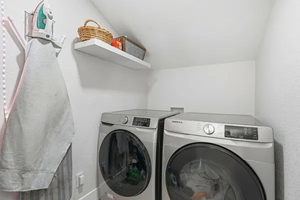 a utility room with dryer and washer