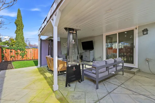 a living room with furniture a garden and a yard