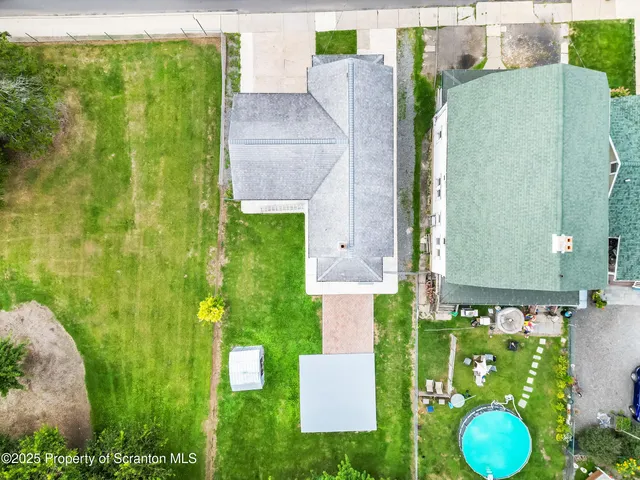 a bathroom with a granite countertop shower and a sink