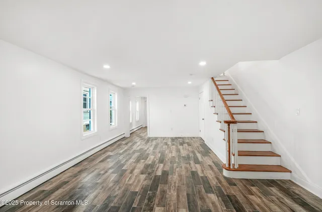 a view of entryway with wooden floor