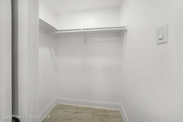 a view of an empty walk in closet