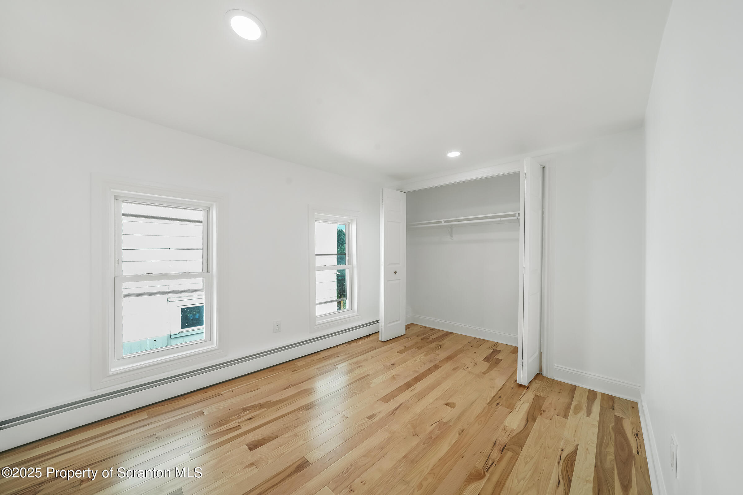 1017 Rutter Avenue Kingston, PA 18704 - Photo 23 of 36 a view of empty room with wooden floor and fan