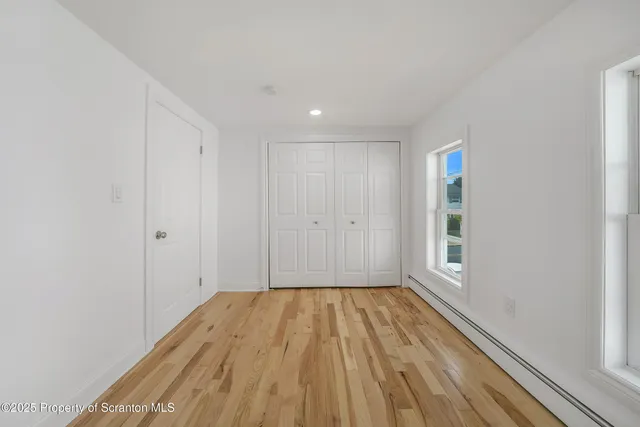 a view of wooden floor in an empty room