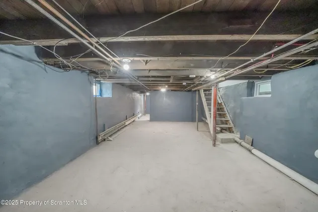 a view of an empty room with a white walls