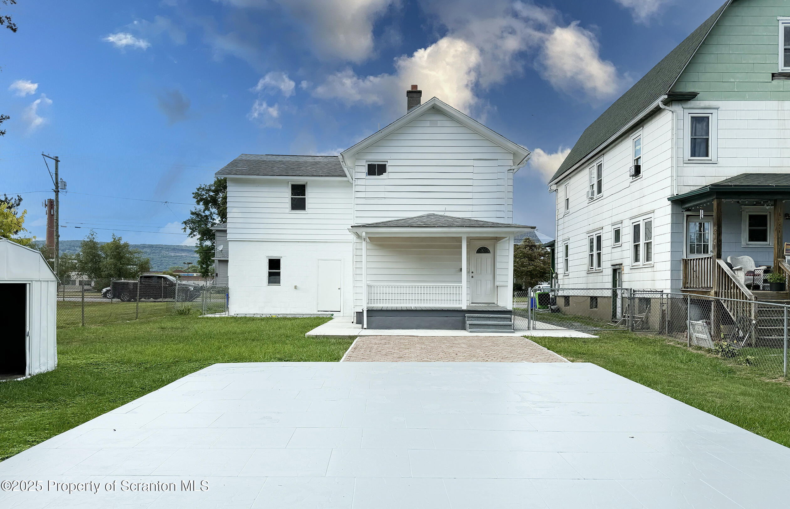 1017 Rutter Avenue Kingston, PA 18704 - Photo 4 of 36 a front view of a house with a yard and garage