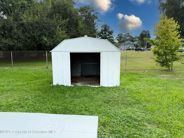 a view of a backyard with a garden
