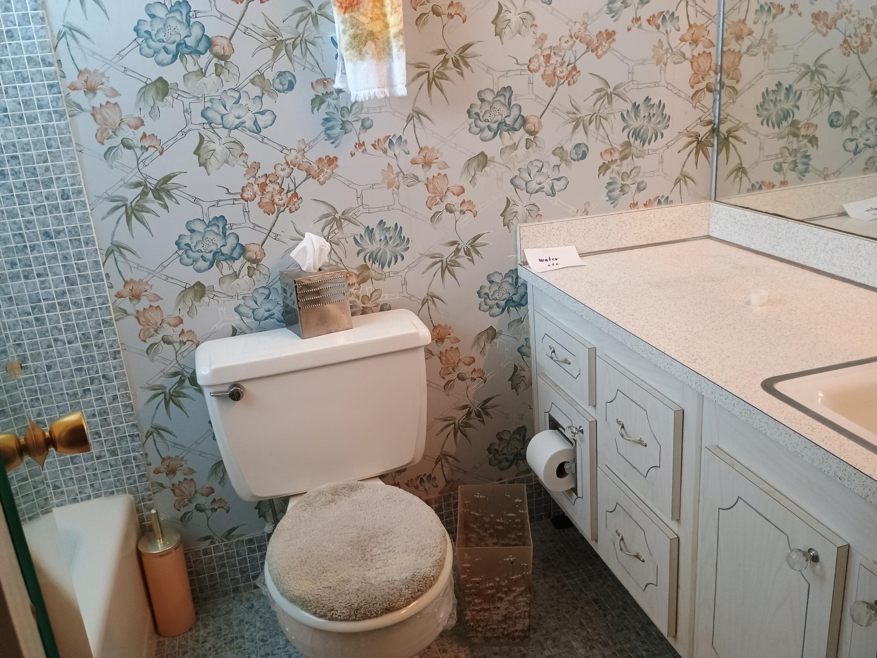 5505 North Ocean Boulevard, Unit 6206 Ocean Ridge, FL 33435 - Photo 20 of 25 a white toilet sitting next to a shower