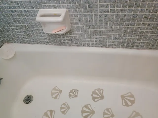 a bathroom with a toilet and a sink