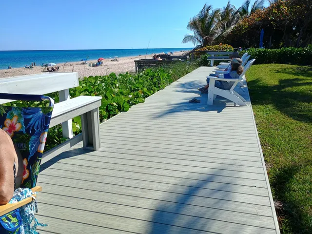 a view of a patio with wooden floor