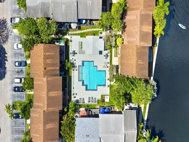 an aerial view of a house with outdoor space