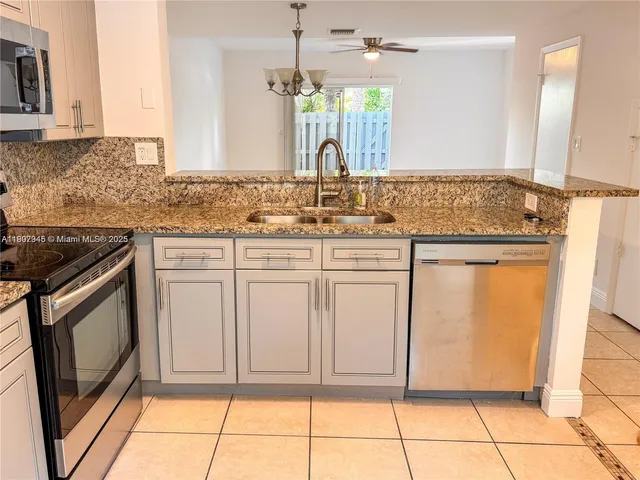 a bathroom with a sink a vanity and a mirror