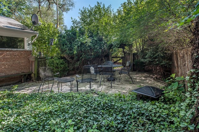 1138 Dell Road Northbrook, IL 60062 - Photo 12 of 16 a view of a chair and table in backyard of the house