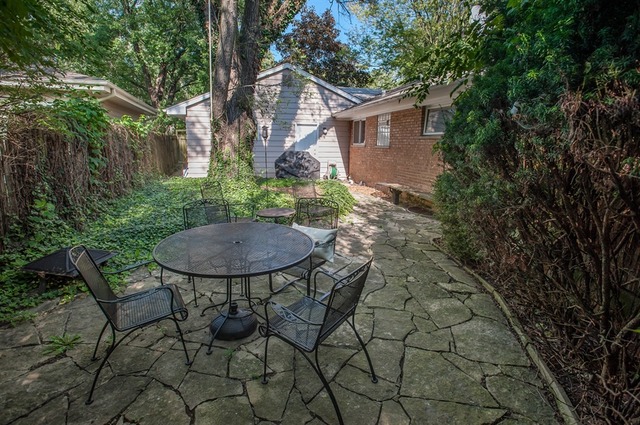 1138 Dell Road Northbrook, IL 60062 - Photo 13 of 16 a view of a chair and table in backyard of the house
