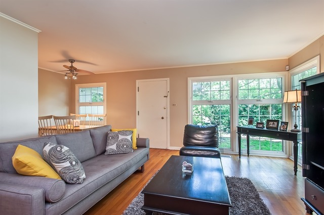 1138 Dell Road Northbrook, IL 60062 - Photo 4 of 16 a living room with furniture and a large window