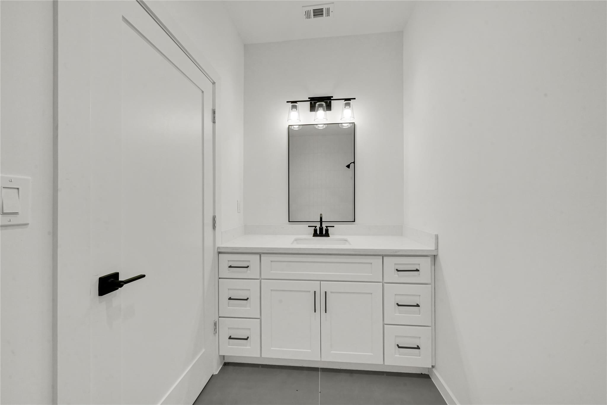 8402 Double, Unit B Houston, TX 77088 - Photo 16 of 21 a bathroom with a sink and a mirror