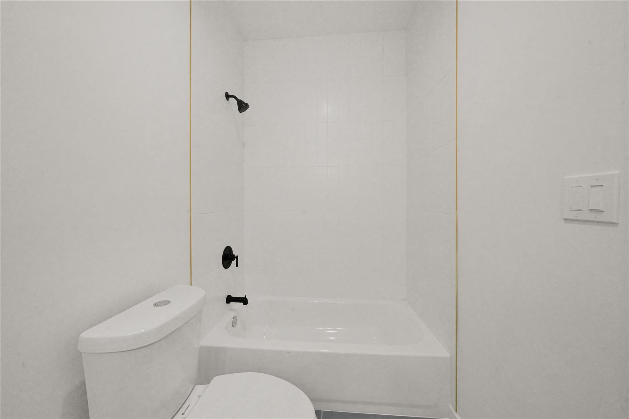 8402 Double, Unit B Houston, TX 77088 - Photo 17 of 21 a bathroom with a toilet and shower