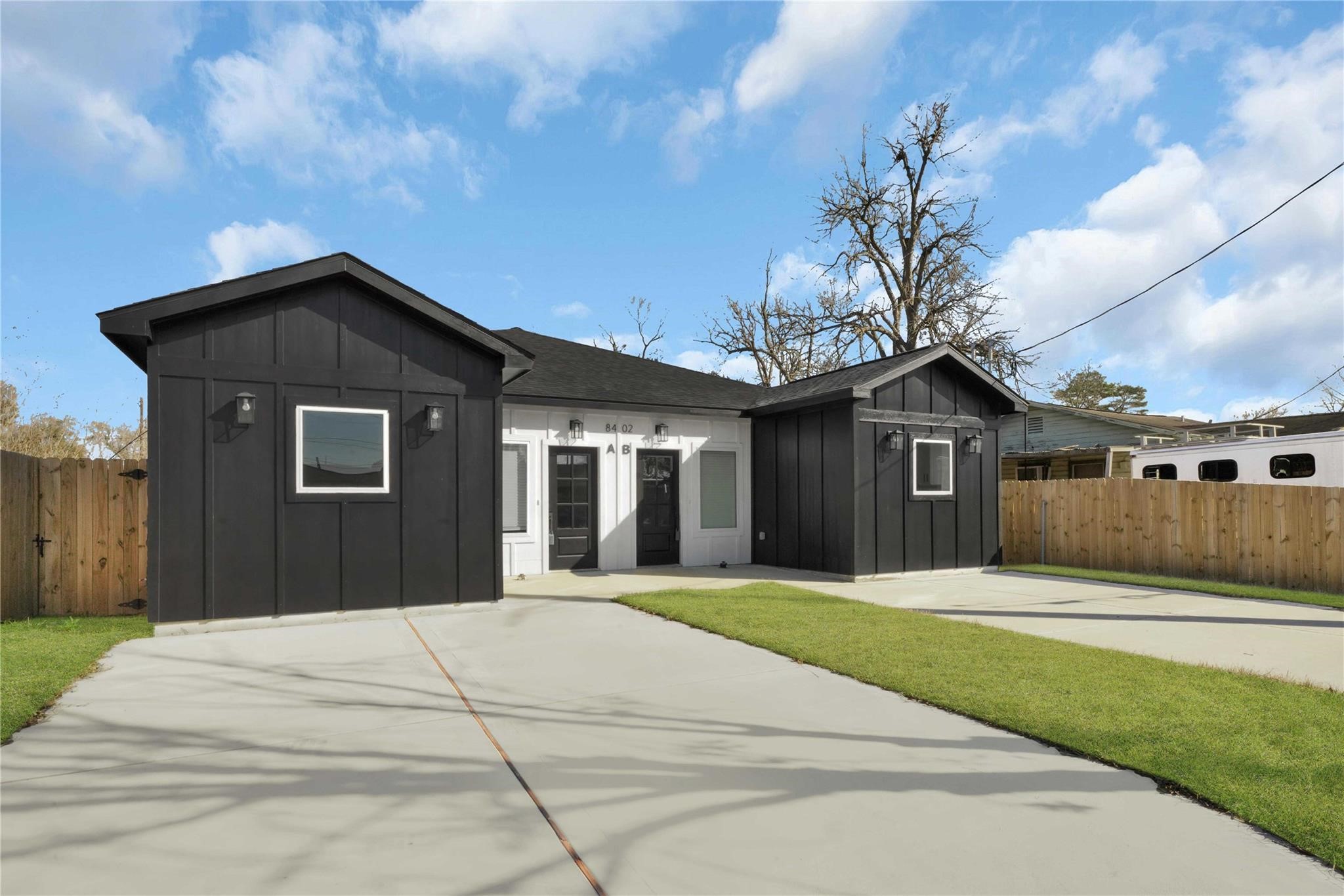 8402 Double, Unit B Houston, TX 77088 - Photo 2 of 21 a front view of a house with a yard