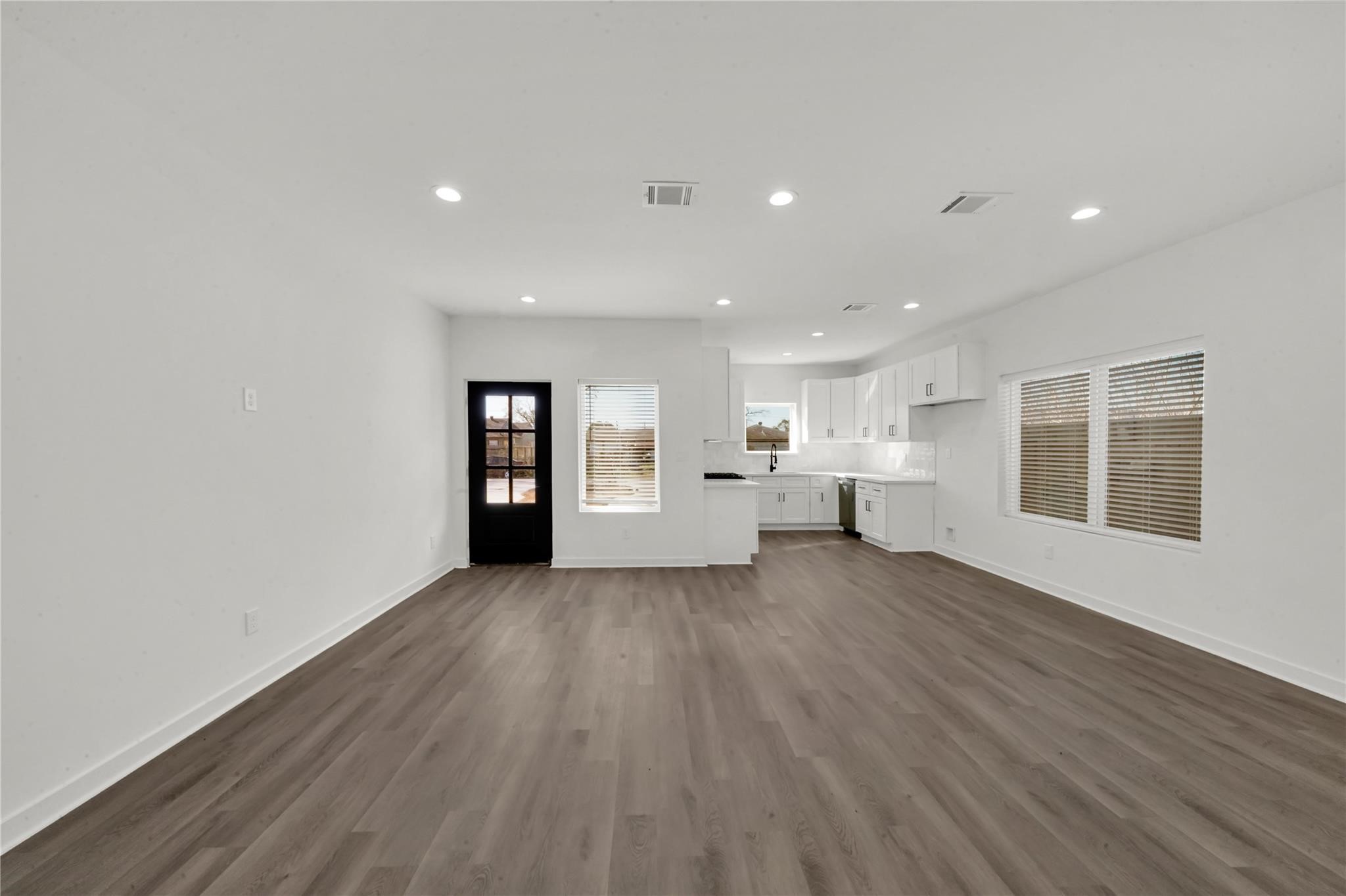 8402 Double, Unit B Houston, TX 77088 - Photo 5 of 21 a view of a big room with wooden floor and windows